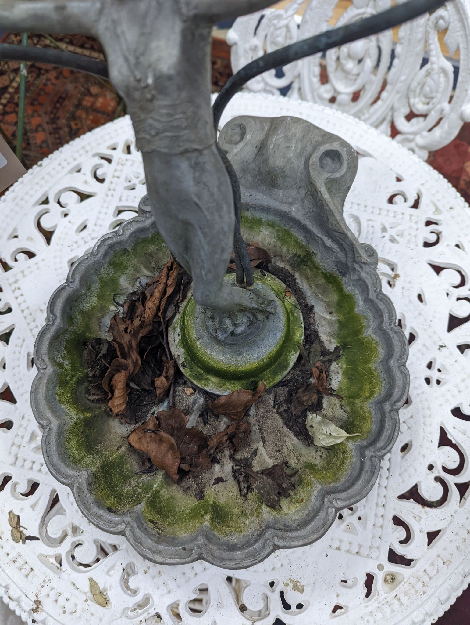 A lead figure and shell garden fountain head, height 32cm
